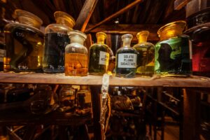 a shelf filled with lots of bottles of liquid