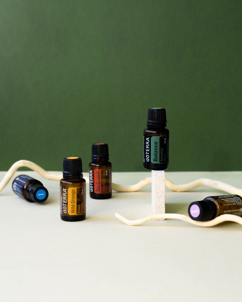 a group of bottles of essential oils sitting on a table